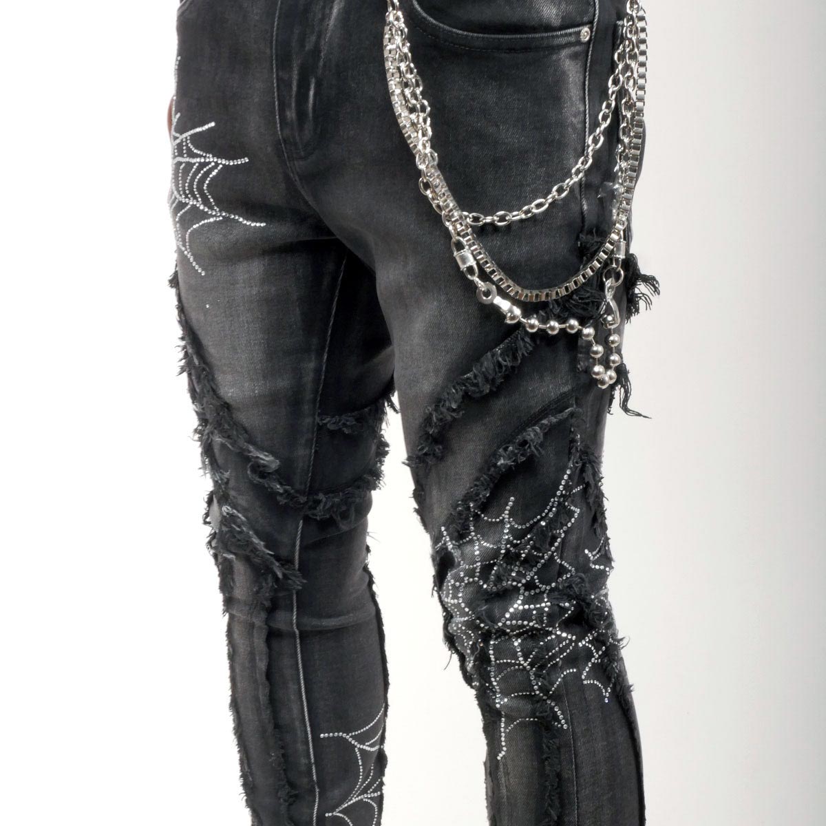 Stack denim pant w/ studded spider webs