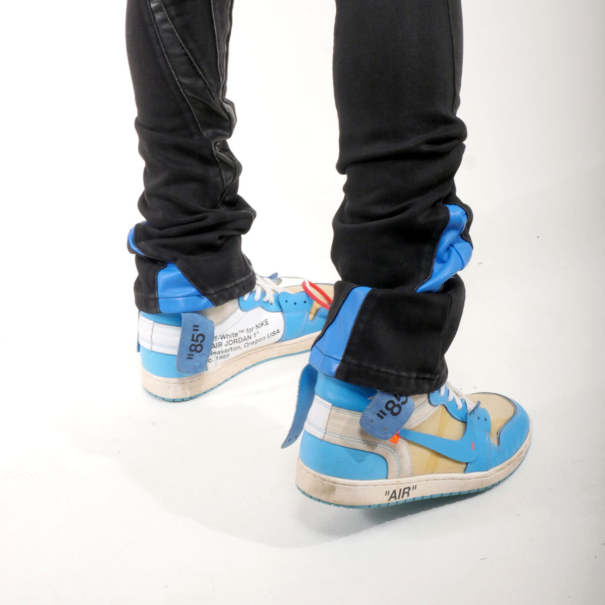 Stack denim w/ leather cut & sew details