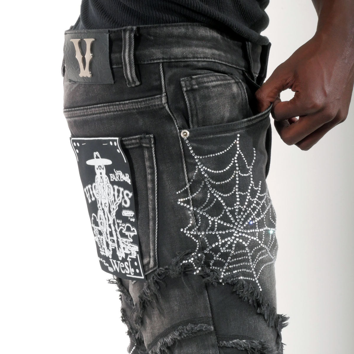 Stack denim pant w/ studded spider webs