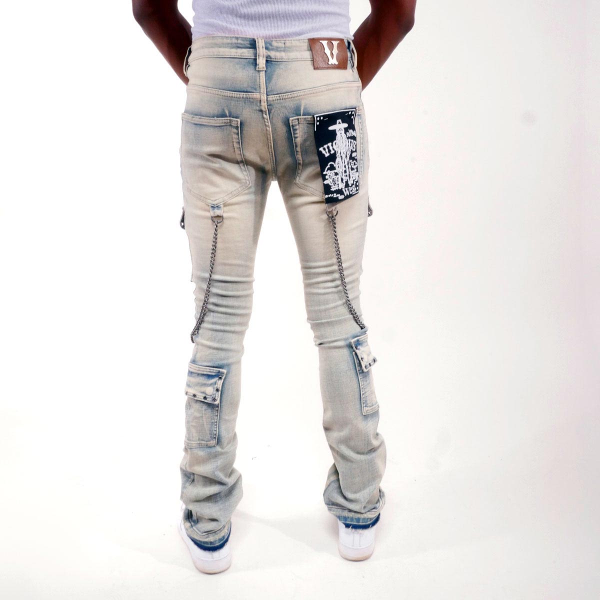 Flare fit denim pant w/ stone details + chains